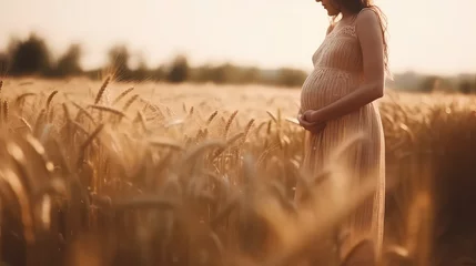 Keuken foto achterwand Weide Pregnant woman in pretty beige lace long dress on wheat field. Creative concept wallpaper of motherhood, parenthood, pregnancy and birth.