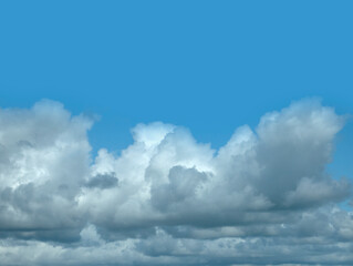 White clouds over blue sky background. Fluffy cumulus cloudscape shape
