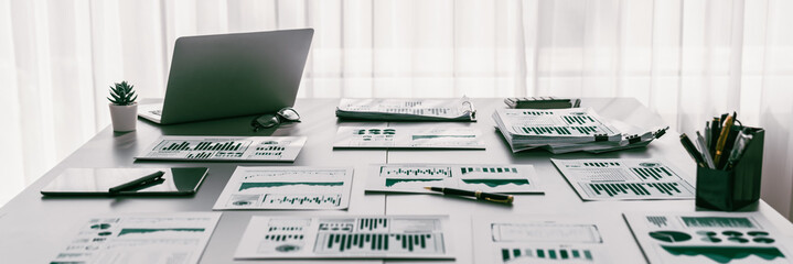BI data dashboard from Fintech on laptop screen displays comprehensive business analysis in empty office. Technology empowering business financial data visualization and growth strategy. Prodigy