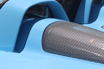 Closeup of Steel mesh on vintage unbranded sports car.