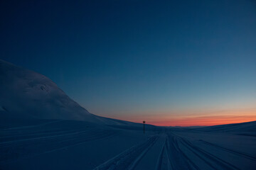 A winter sunset at Kungsleden skiing trail near Viterskalet, Lapland, Sweden