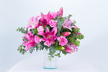 Beautiful bouquet arranged in a vase, on a white background