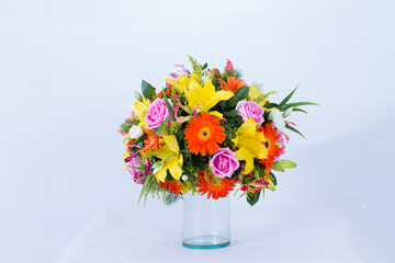 Beautiful bouquet arranged in a vase, on a white background