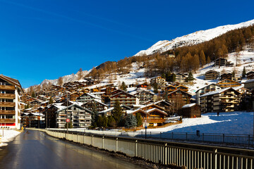 Townscape of Zermatt, Switzerland. View of residential buildings and mountains.