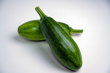 Harvested zucchini, close-up, white background