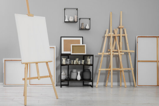 Artist's studio with easels, canvases and painting supplies
