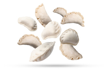 Many raw dumplings falling on white background