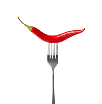Fork with chili pepper isolated on white © New Africa