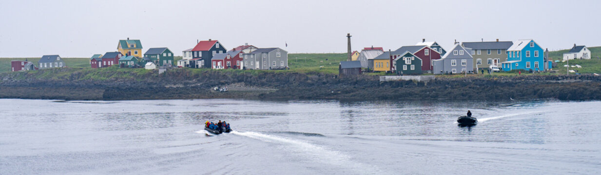 zodiacs approach flatey island, iceland