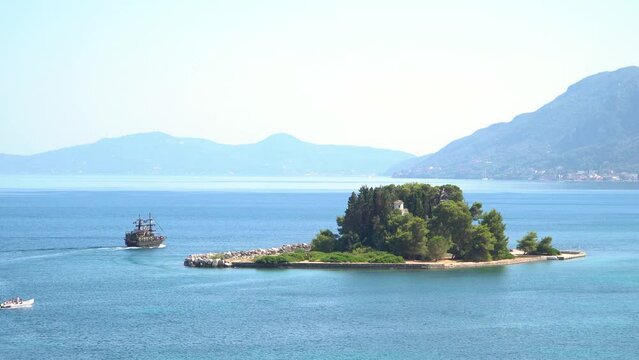 Tourist Pirate Ship Approaches Pontikonisi Island Corfu Greece, Panoramic View from Kanoni Kerkyra