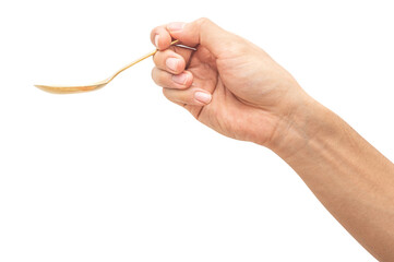 isolated of a man's hand holding a golden steel spoon.