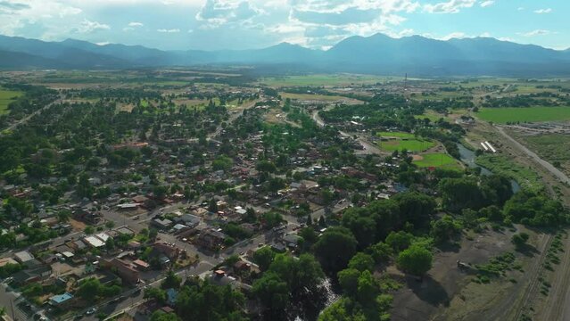 Salida Colorado aerial cinematic drone mid summer downtown S Lime Mill near Buena Vista on Arkansas River Riverside Park Scout surfing wave biking hiking rafting Rocky Mountain forward up movement