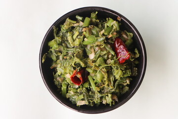 Stir fried chayote shoots, chayote or sechium edule leaf curry or salad