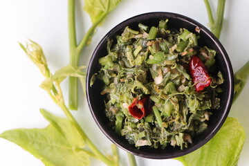 Stir fried chayote shoots, chayote or sechium edule leaf curry or salad