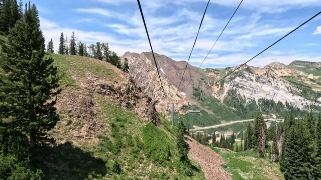 Mountain summer ski lift rocky forest Snowbird Utah do. Summer winter season mountain resort. Vacation nature family fun destination. Peaks nature landscape forest. Rocky Mountain Salt Lake City Utah.