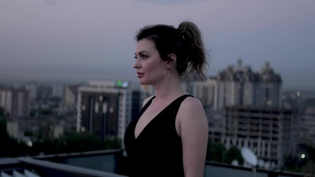 Woman at the roof is thinking about 
something