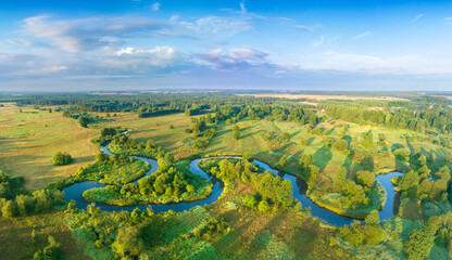 Beautiful spring morning over the forest and river - drone aerial view