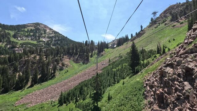 Mountain ski lift summer forest mountain Snowbird Utah. Summer winter season mountain resort. Vacation nature family fun destination. Peaks nature landscape forest. Rocky Mountain Salt Lake City Utah.