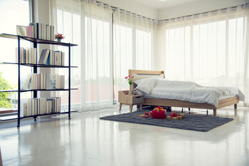 Blur background bedroom home interior in cozy decoration room. Clean soft bed stylish decor relax dorm with copy space. Modern apartment white light trendy style. Blurred background defocused indoors