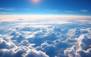 the aerial view of clouds and sky as seen from inside an airplane. - Powered by Adobe