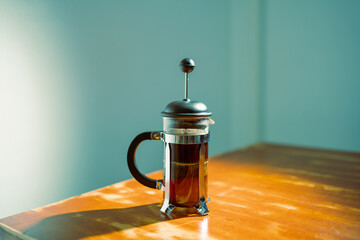 French press coffee maker on a table