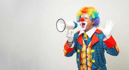 Mr Clown. Funny shocked face comedian Clown man in colorful costume wearing wig shout out loud wow with megaphone mouth announcement. Happy expression amazed bozo in various pose on isolated.