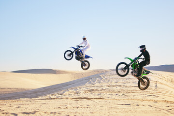 Fototapeta na wymiar Motorcycle, desert and jump in air, speed and competition at outdoor race for performance, goal or off road. Motorbike athlete, dune and ramp in nature, sand or together for training in mockup space