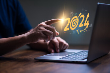 Trends for 2024 concept, Businessman searching for 2024 trends  for marketing monitor and business planing in new year concept. marketing trends, Design trends, global trends.