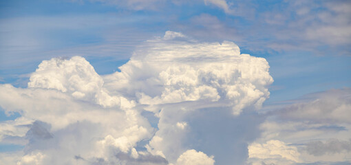 Panorama of large white clouds and blue sky
