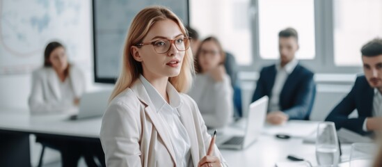 Female professional giving a presentation in an office , white light background