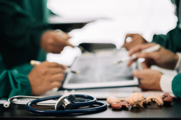 Medical team working on digital tablet healthcare doctor technology tablet using computer analyzed the results of medical reports, an online conference at the hospital.
