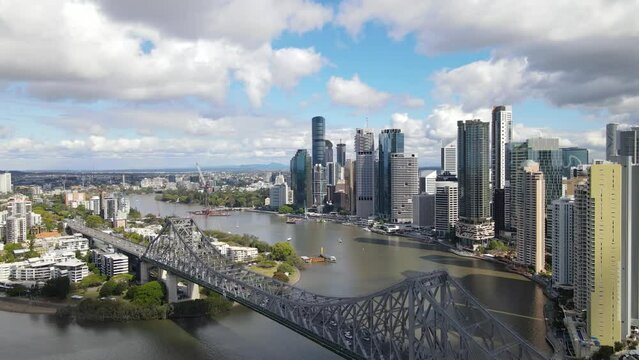Aerial drone view above Story Bridge in Brisbane City, QLD, Australia looking toward the east facing side of the city along Brisbane River in August 2023    