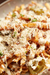 French fries topped with cheese on a plate