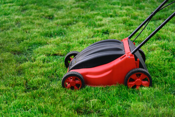 Lawnmower machine trimming on the grass