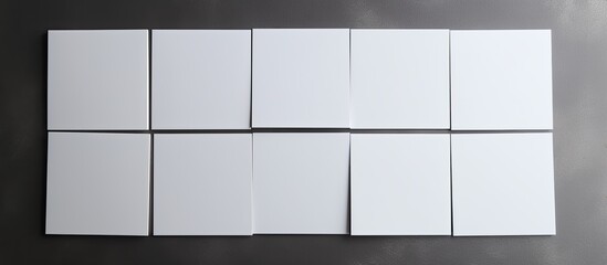 white business cards with copy space on a grey background. It depicts business, business cards, stationery, and writing space.