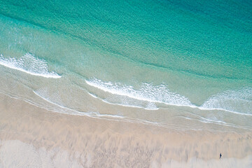 zenithal aerial view of the shore of a turquoise water beach