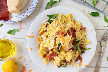 Traditional Italian pasta salad, a traditional Italian recipe with ham and Parmesan cheese.