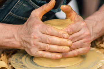 Clay craftsman sculpts crockery