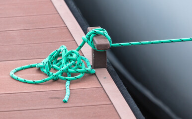A rope tied to hold the boat