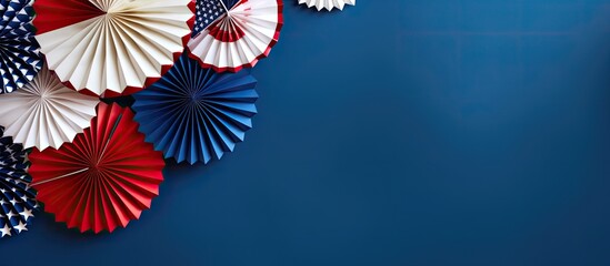 American Independence Day decorations on a blue background, displayed in a flat lay style with a top view. also copy space available.