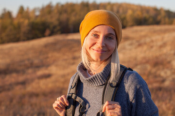 Middle Aged Woman Hiking and going Camping in nature - 632034541