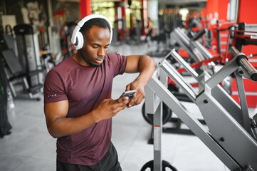 Young athletic African American man in the gym