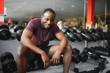 Young athletic African American man in the gym