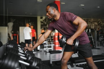 Fototapeta na wymiar Young athletic African American man in the gym