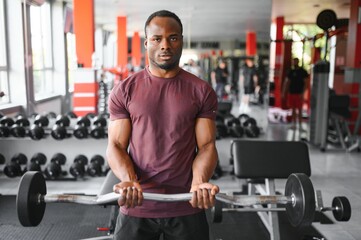 Naklejka na ściany i meble Portrait of male African American athlete on training