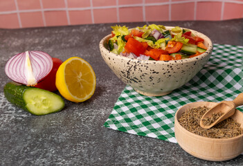 Kachumber Salad is the Indian cucumber, tomato, and onion salad. This is a fresh, easy chopped salad with cumin or cumin seeds. The vegetables are dressed with lemon juice and salt.  