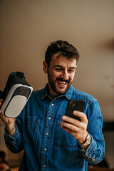Man using the phone and virtual reality. Education and fun