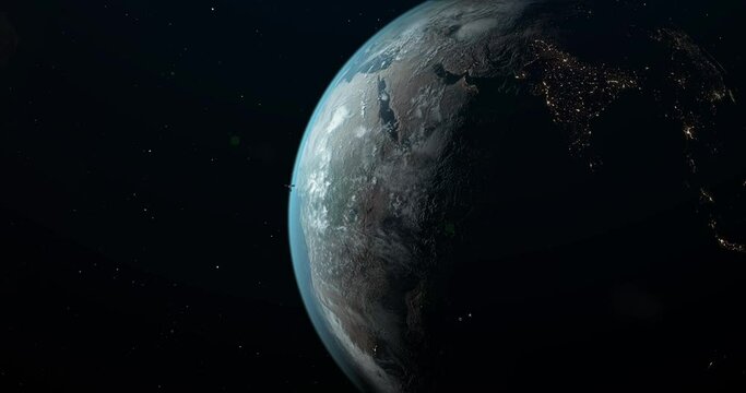 Planet Earth in open space, with a clearly visible terminator line dividing the planet into the bright daylight side and the dark nighttime side.