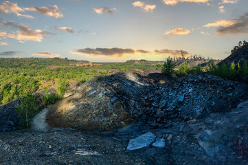 Stones and empty rock that remained after the extraction of iron ore in a quarry