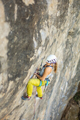 Women climbing in mountains, courage safety and determination